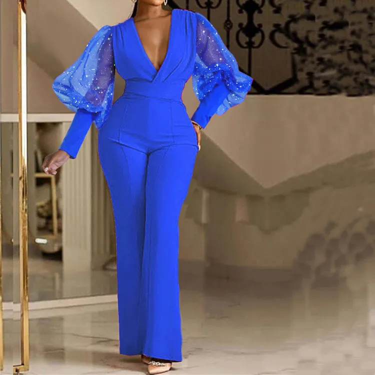 Women's wide leg jumpsuit with mesh stitching detail on long sleeves and elastic waistband
