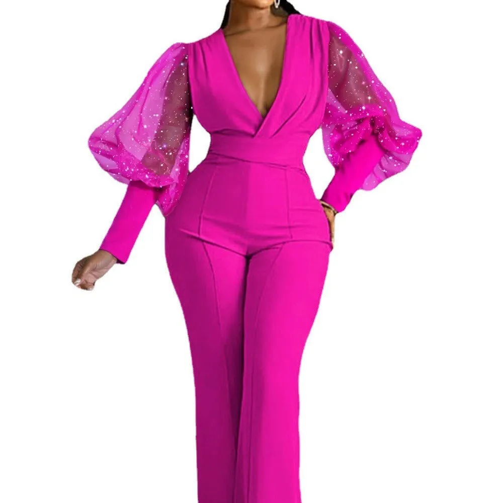 Women's wide leg jumpsuit with mesh stitching detail on long sleeves and elastic waistband
