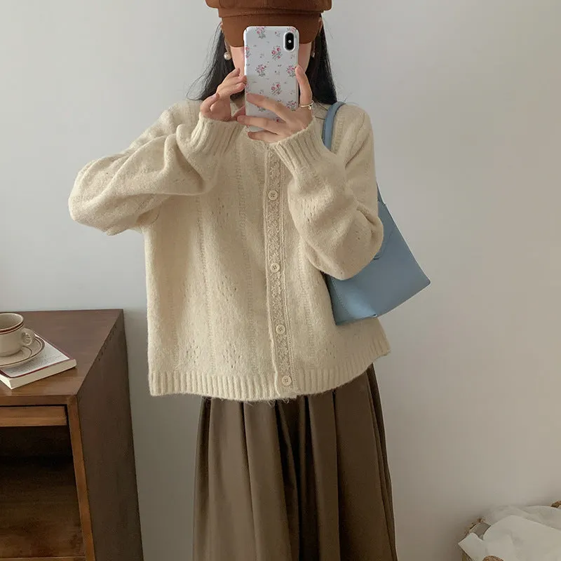 Art retro style Korean knit sweater coat cardigan in a loose free size, shown in apricot colour.