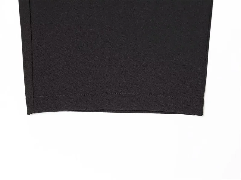 Women's black nylon high-waist zip-front straight-leg trousers on model