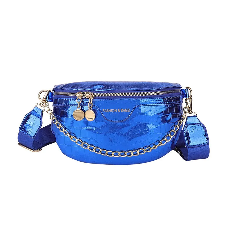 Shiny hard-shell PU chest bag with wide shoulder strap, chain detail, and internal pockets in silver colour