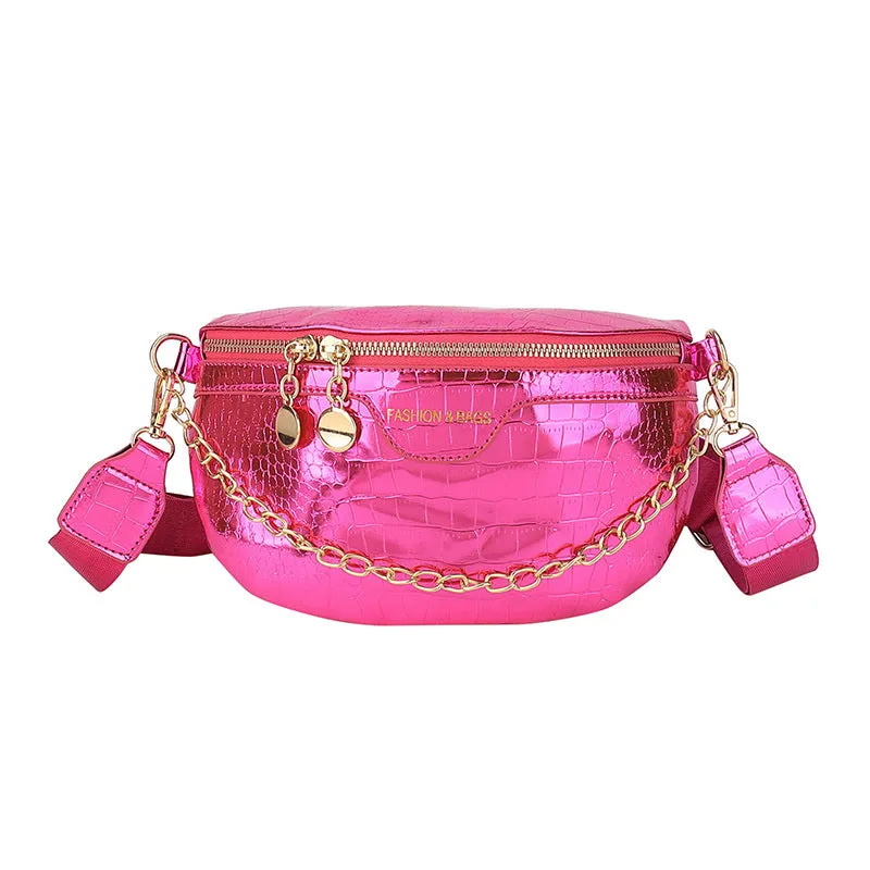 Shiny hard-shell PU chest bag with wide shoulder strap, chain detail, and internal pockets in silver colour