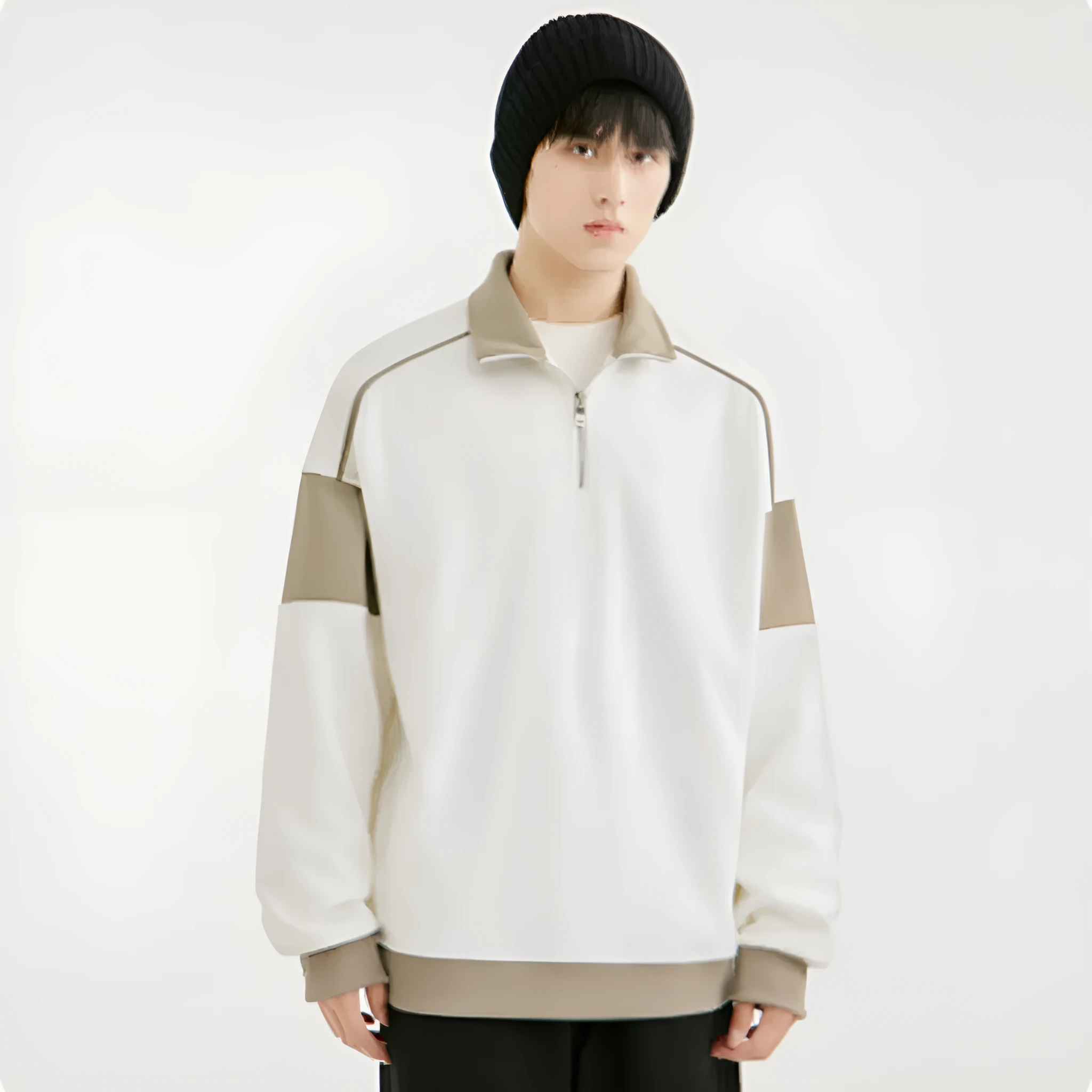 Man wearing a beige hooded corduroy sweater with drop shoulders and loose lapels.