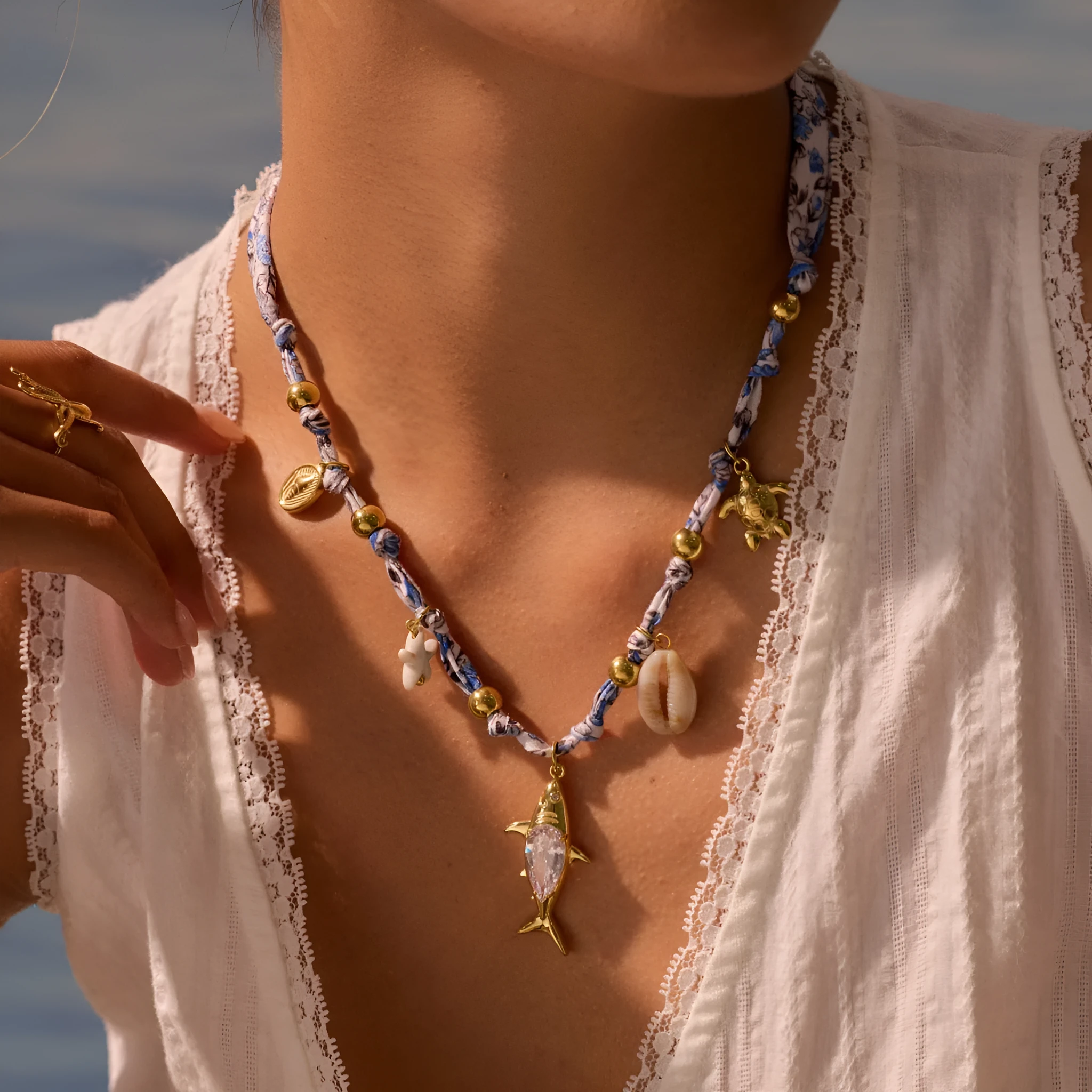 Gold starfish shell pendant on hand-knotted rope chain, 18K plated stainless steel, geometric shape