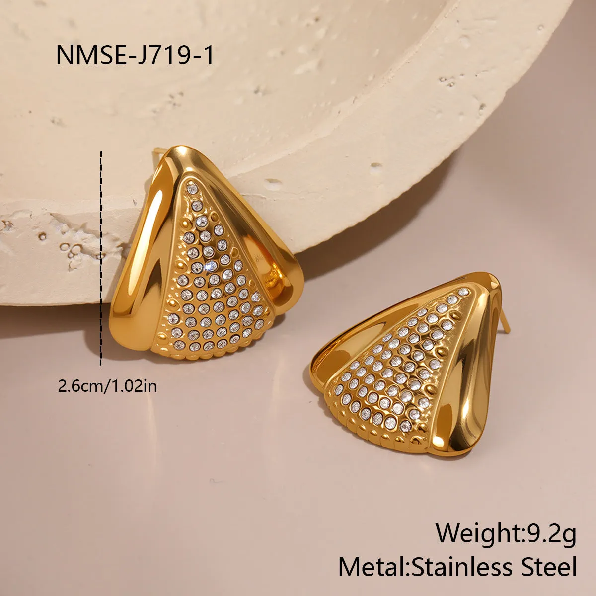 Gold triangle stainless steel geometric stud earrings with electroplated finish on white background