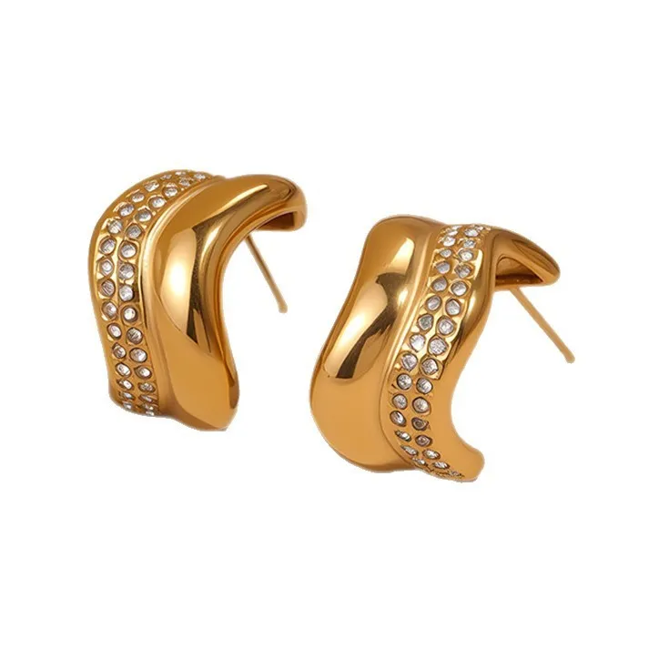 Gold triangle stainless steel geometric stud earrings with electroplated finish on white background