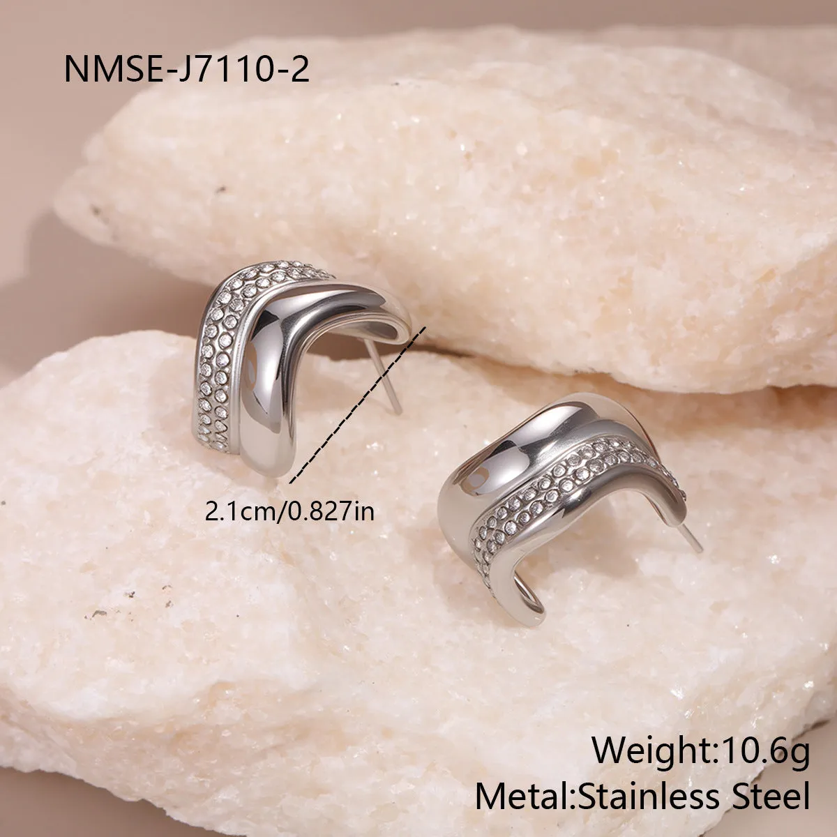 Gold triangle stainless steel geometric stud earrings with electroplated finish on white background