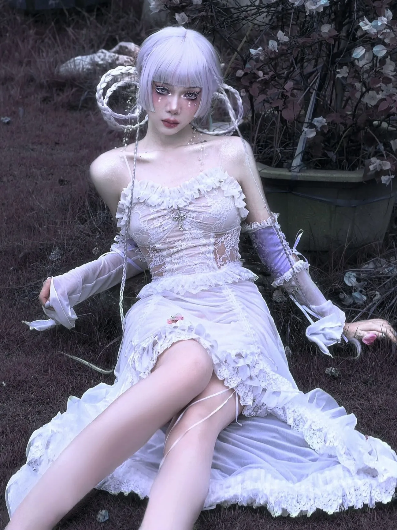 Chinese style white gothic drawstring mesh dress with dark straps and detached oversleeves on display