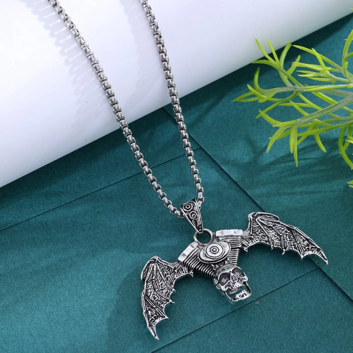 Gothic dark skull necklace with aluminium alloy skeleton wing pendant on dark background