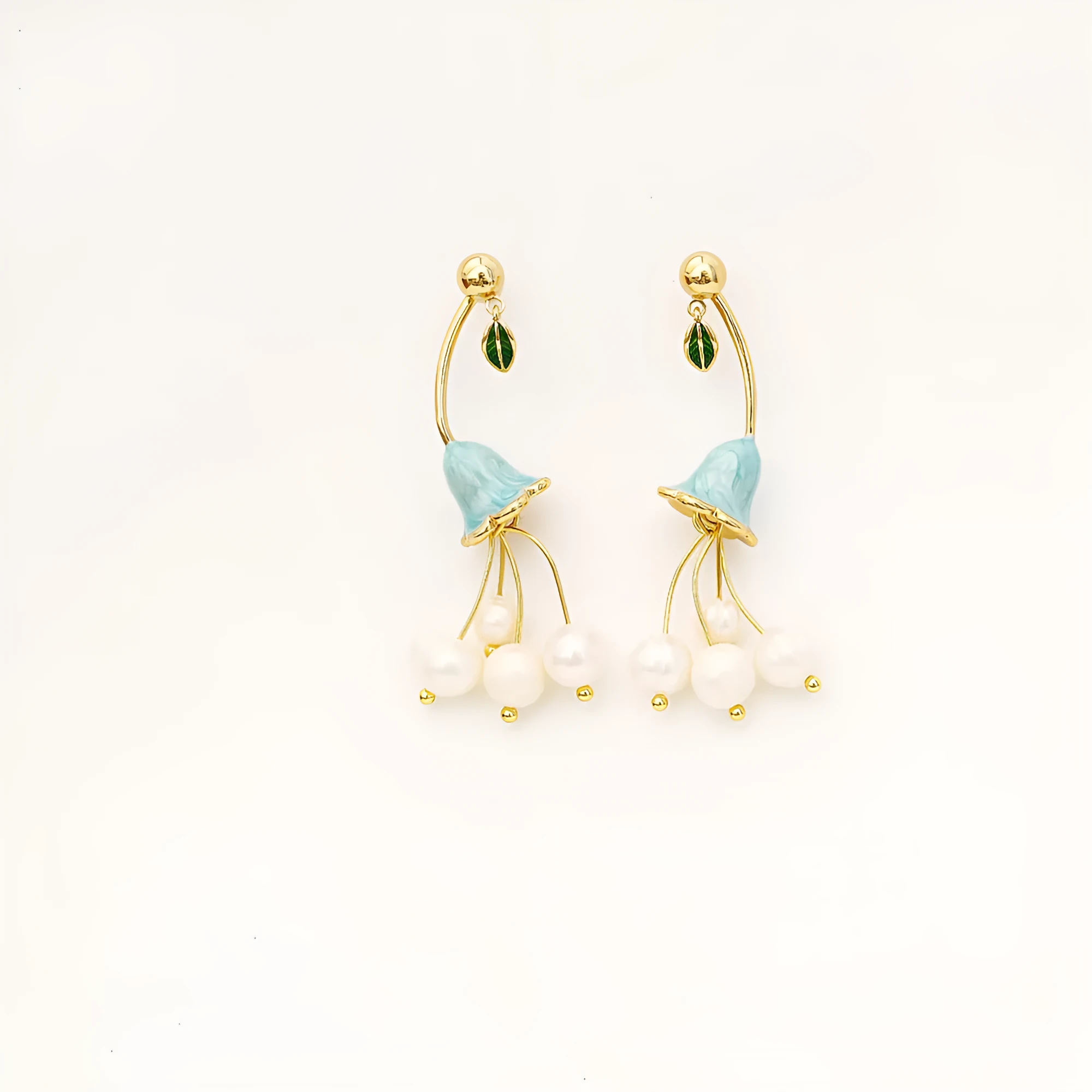 Natural baroque pearl ear studs with 14K real gold plated lily flower copper setting on white background
