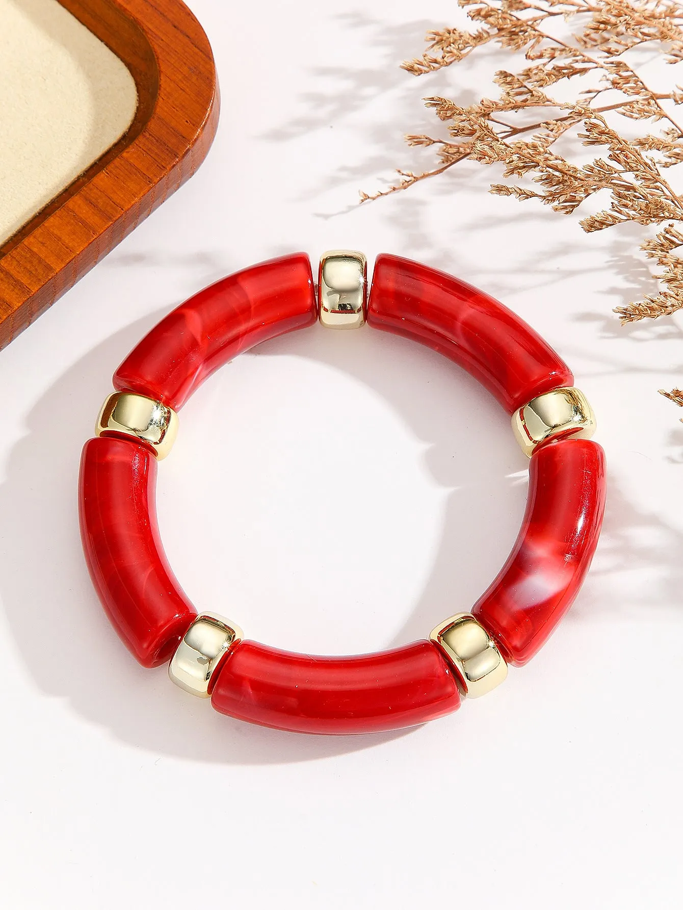 Acrylic bent tube bracelet in selected colour, lightweight and adjustable design.