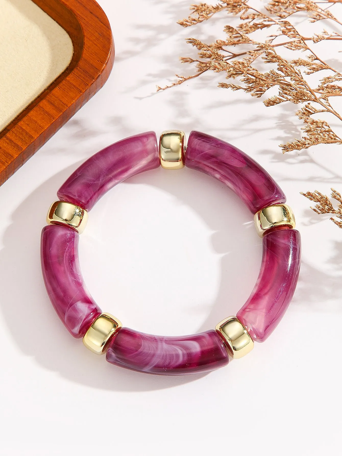Acrylic bent tube bracelet in selected colour, lightweight and adjustable design.