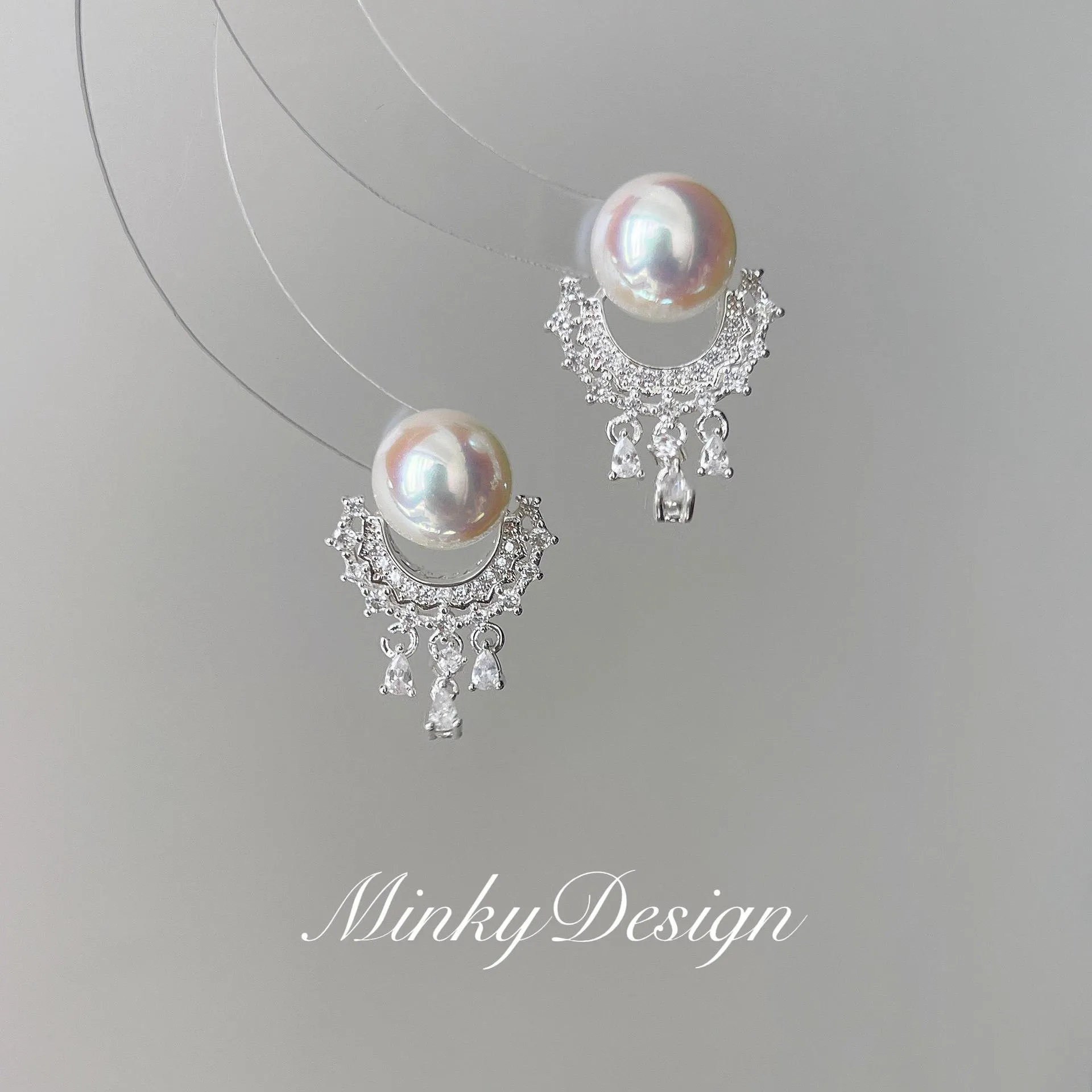 Artificial crystal water drop tassel earrings with round geometric shape and mosquito coil ear clip