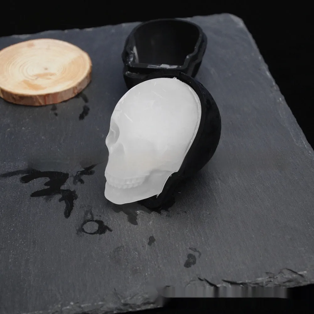 3D Halloween skull ice cube tray made from blue food-grade silicone on a white background.