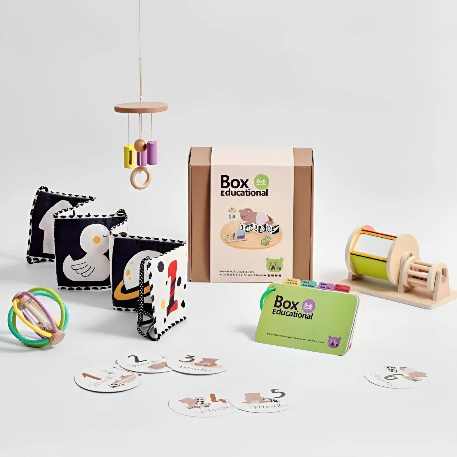 Educational wooden Montessori rattle set with black and white cards and ball chime in colour box packaging