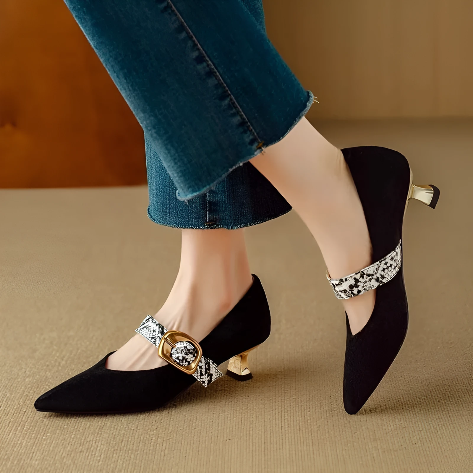 Women's black stiletto heels with buckle fastening and pointed toe design
