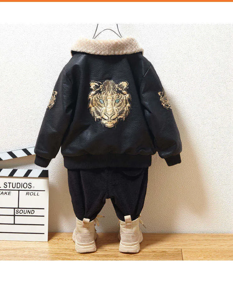 Black PU leather long-sleeved plus velvet jacket for boys with lapel collar and zipper closure, flat lay view