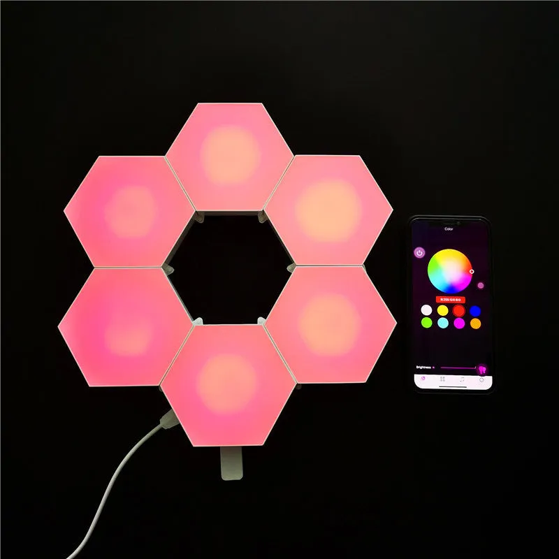 Close up of a modular hexagon LED wall light in a honeycomb pattern with multiple colour panels