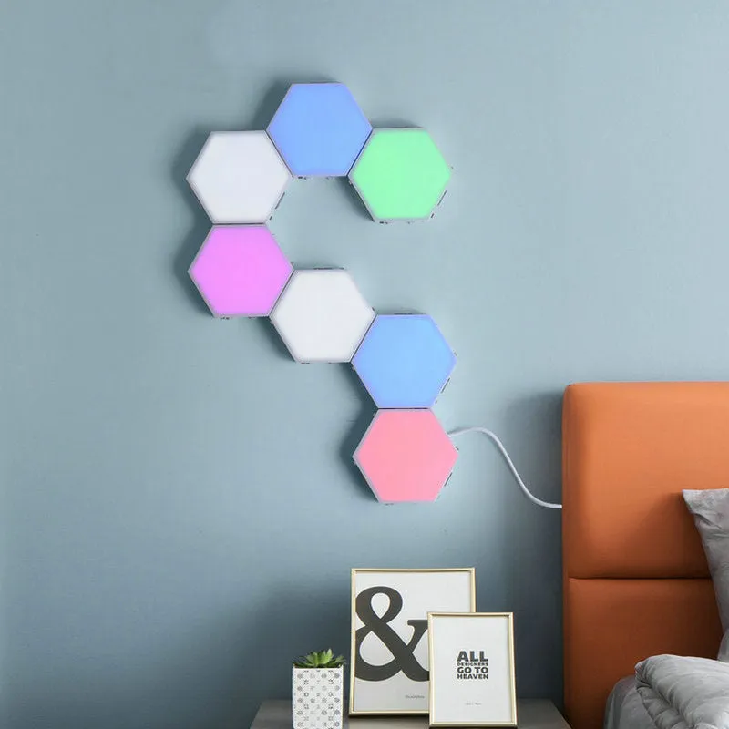 Close up of a modular hexagon LED wall light in a honeycomb pattern with multiple colour panels