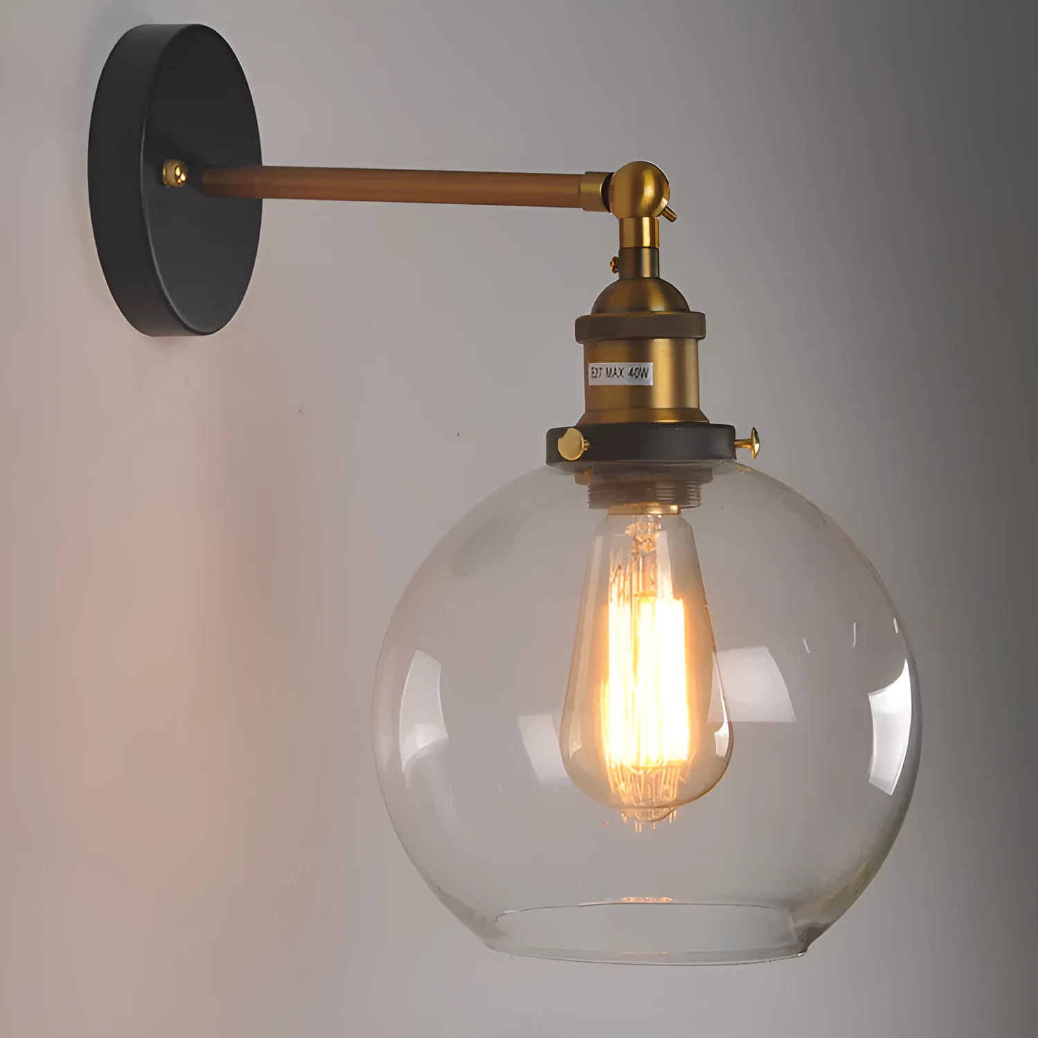 Round retro glass ball wall lamp in amber colour, 20cm diameter, with aluminium holder.