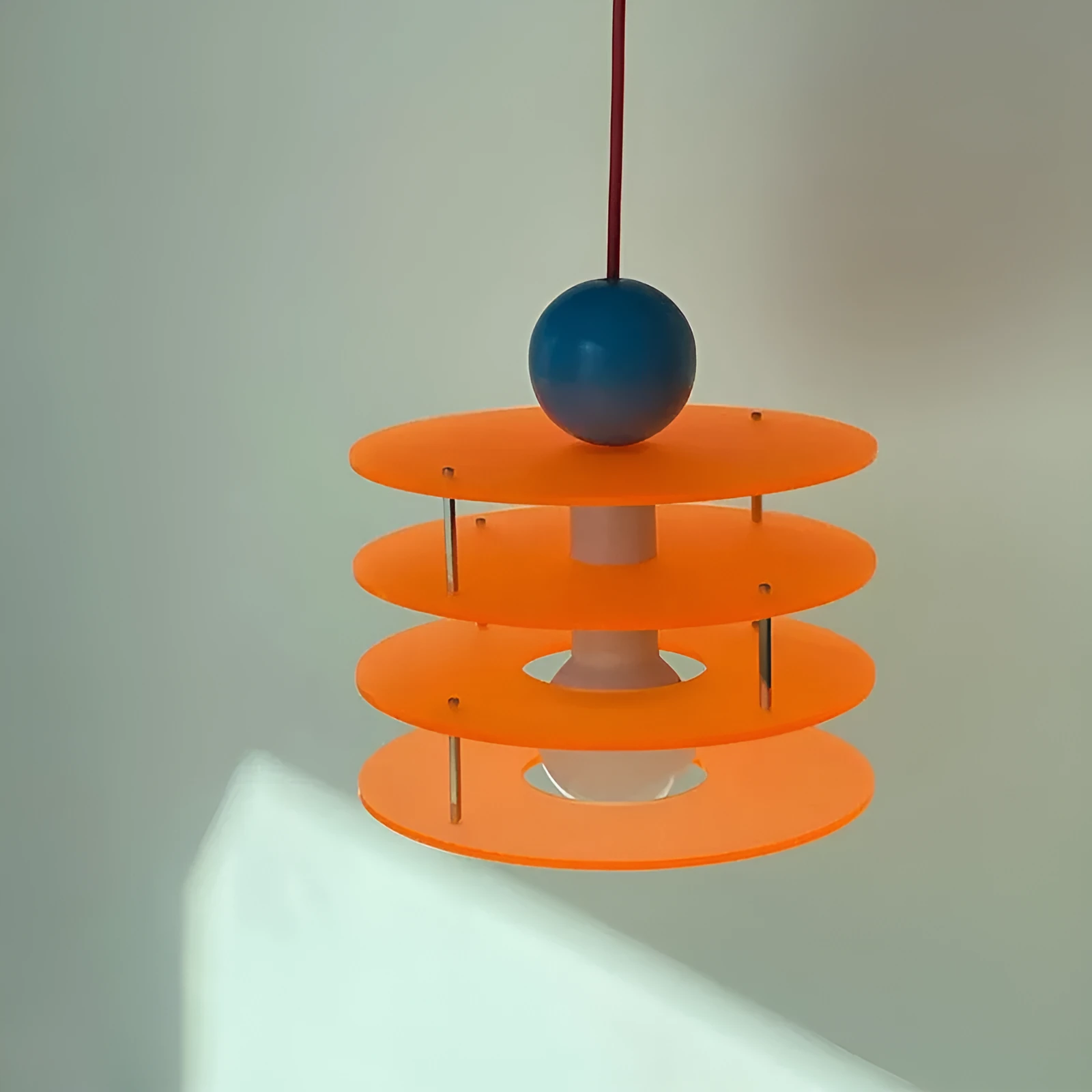 Personalised macaron restaurant chandelier in frosted blue hanging from ceiling