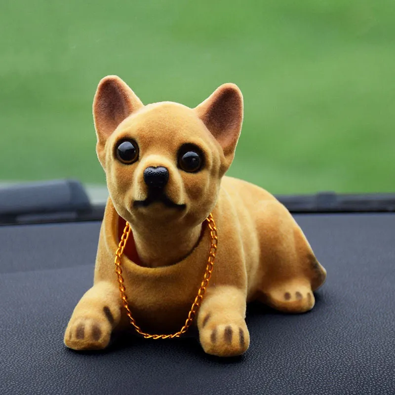 Synthetic resin shake head dog doll in husky design with white auspicious fruit accent on car dashboard