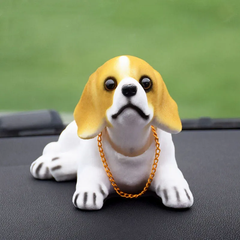 Synthetic resin shake head dog doll in husky design with white auspicious fruit accent on car dashboard