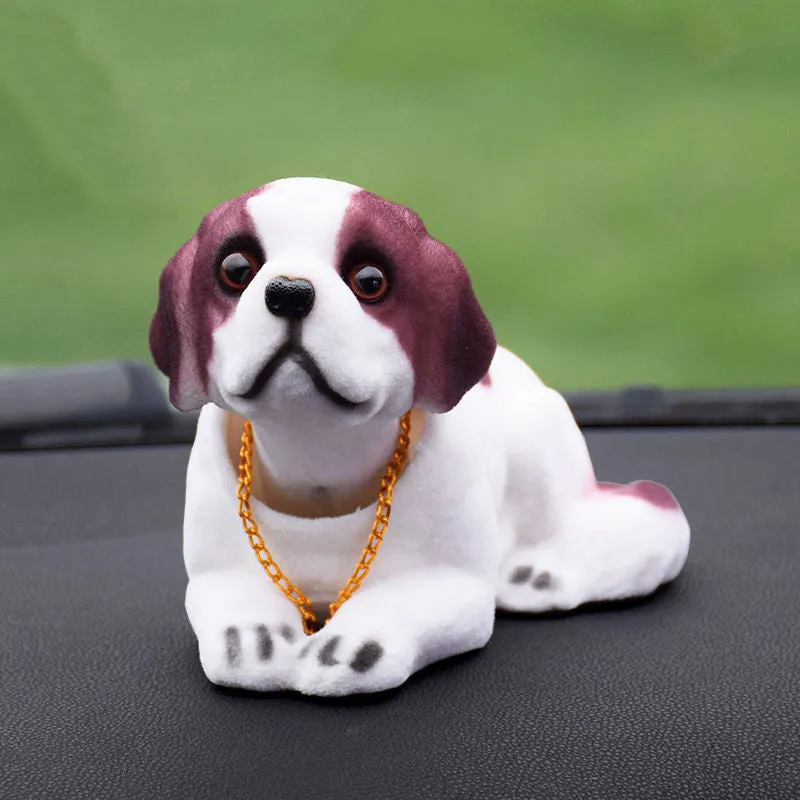 Synthetic resin shake head dog doll in husky design with white auspicious fruit accent on car dashboard