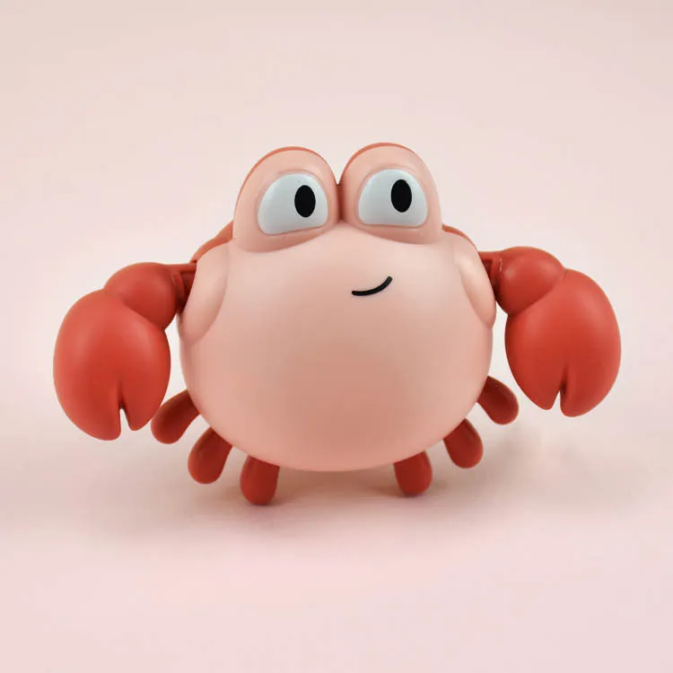 Clockwork crab and turtle bath toys floating on water – pink and blue options