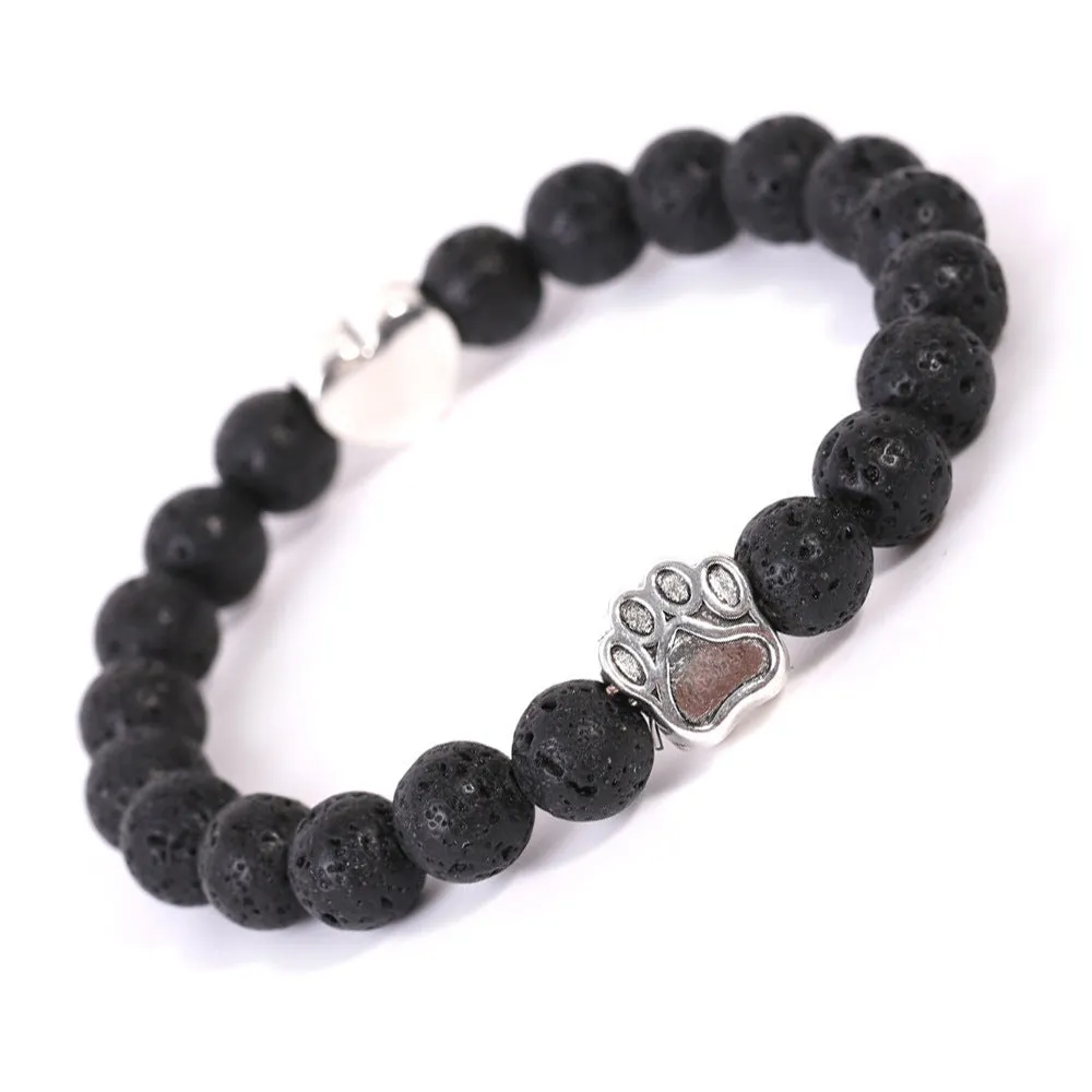 Tigereye and Indian agate stone beaded bracelet with a silver dog's paw charm and a geometric peach heart charm on a white background.
