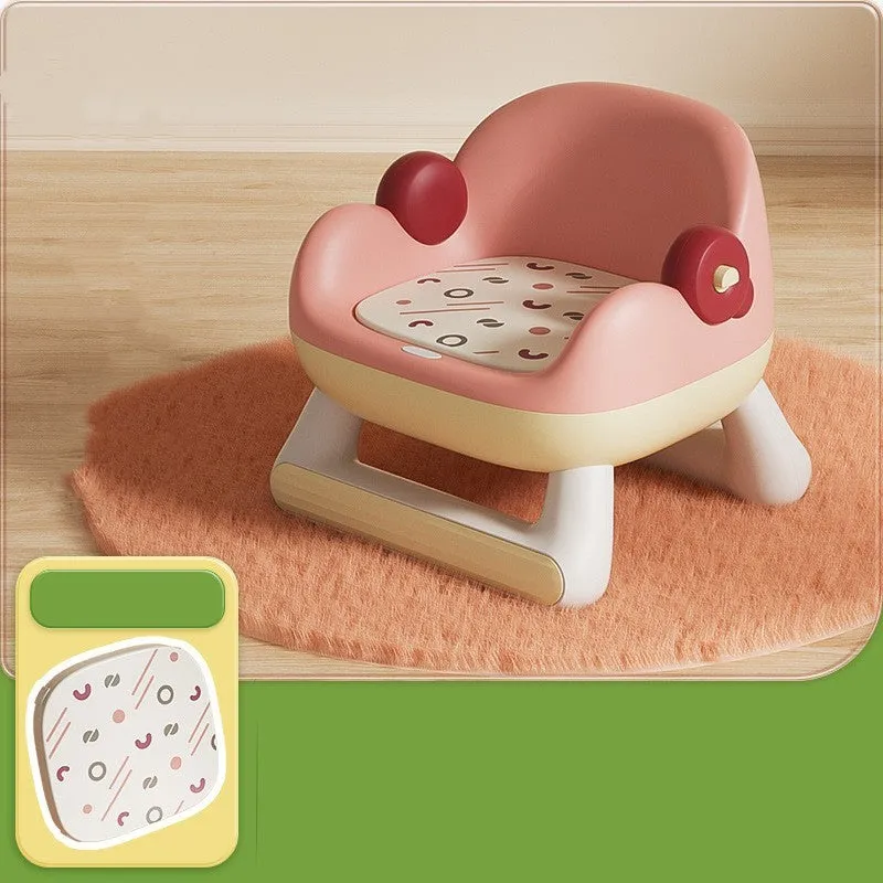 Blue plastic children's dining chair with backrest and PVC soft cushion on a white background