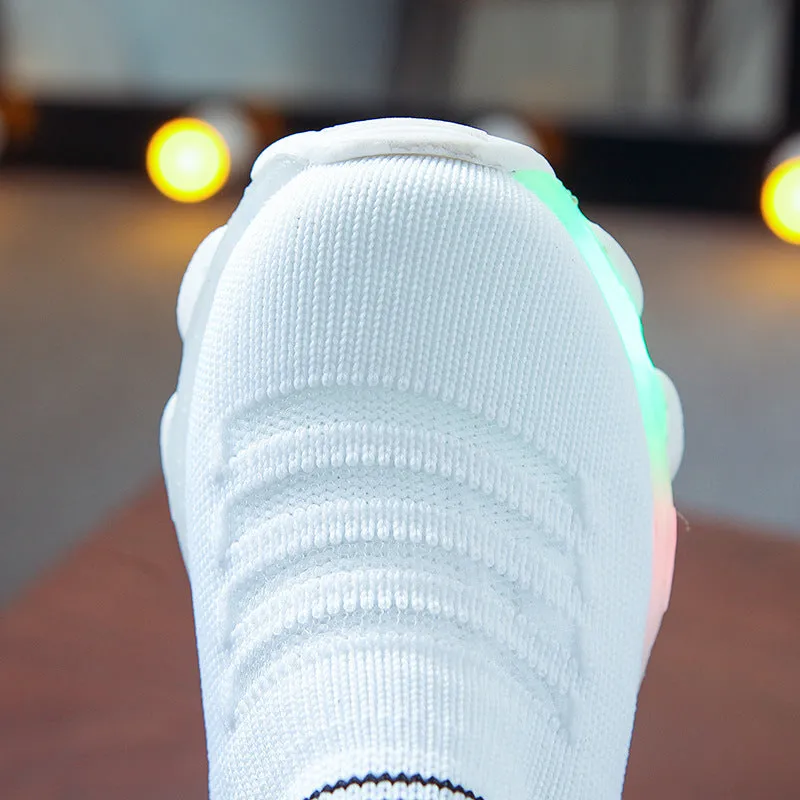 Flying woven sneaker overshoes in black with EVA sole, side view showing slip-on design