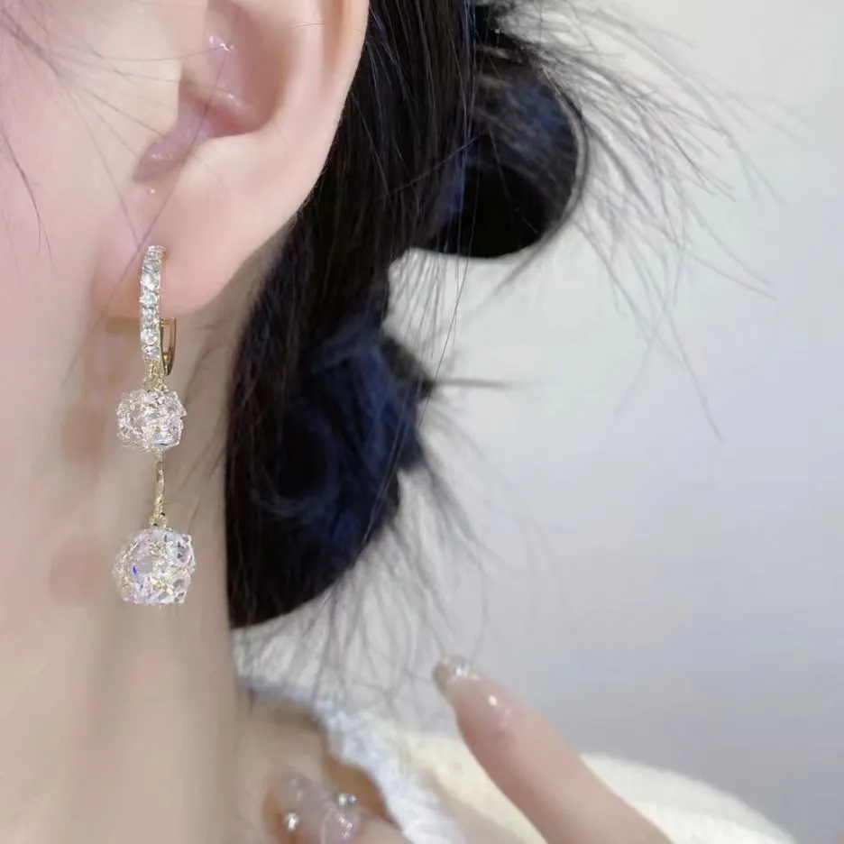 Silver tassel ball earrings with rhinestone drops and confession balloon motifs on copper base