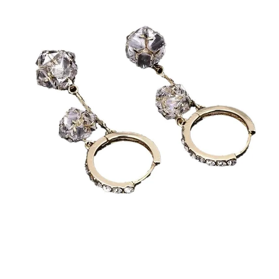 Silver tassel ball earrings with rhinestone drops and confession balloon motifs on copper base