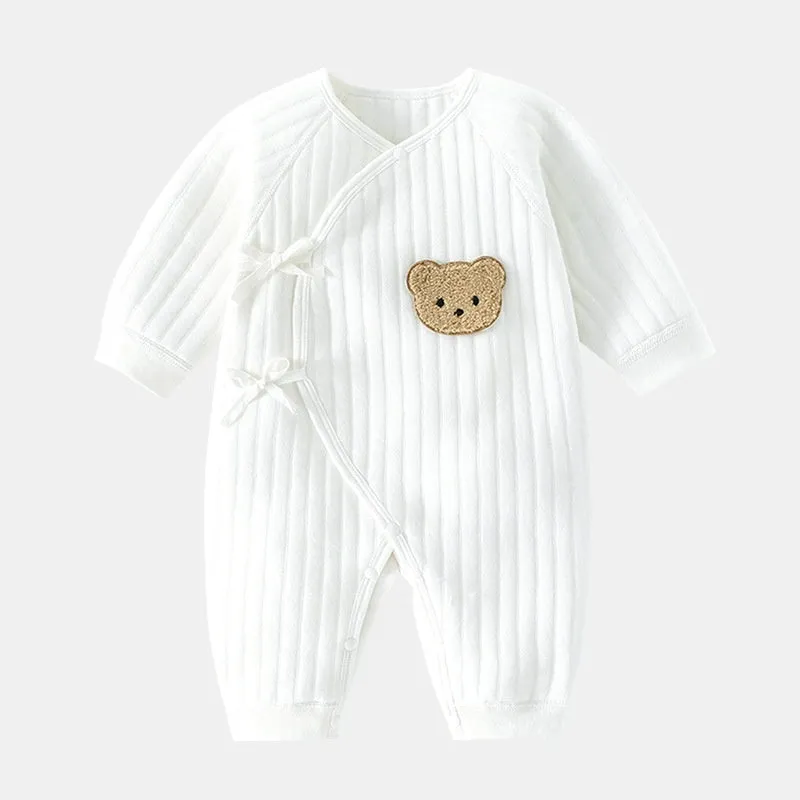 White cotton newborn jumpsuit with top fly lace closure and jacquard teddy bear straps