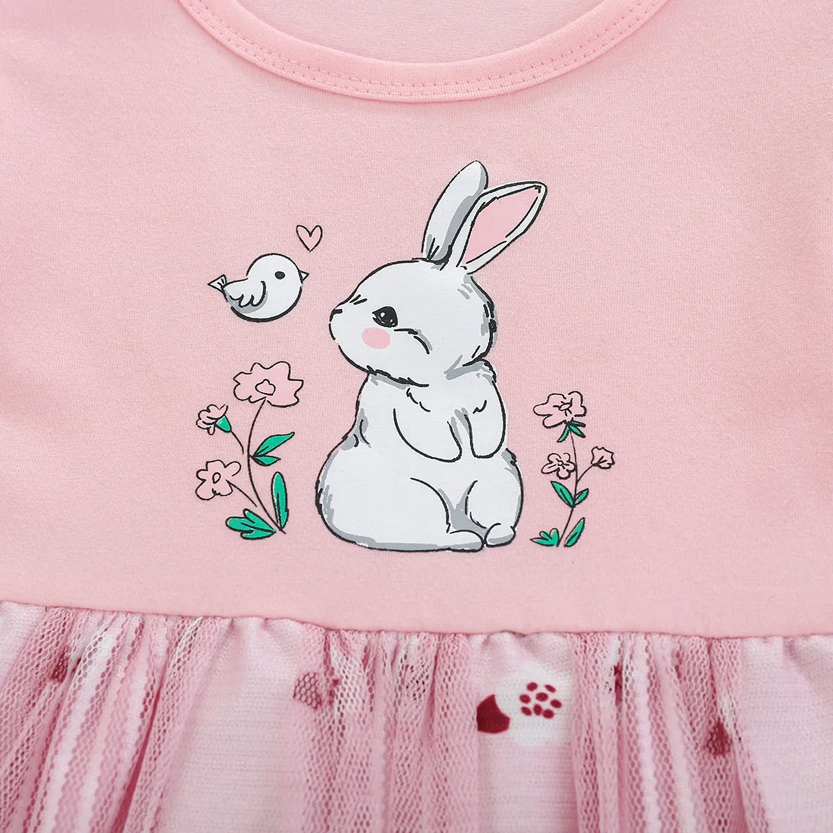 Pink cotton girls princess dress with cartoon rabbit print and mesh overlay on plain background