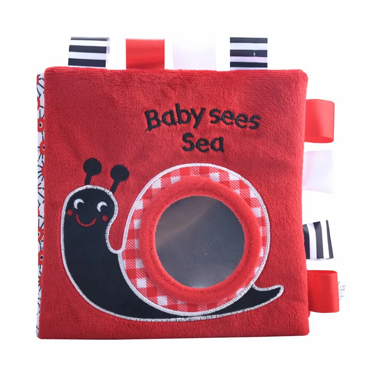 Four cloth books with bird, snail, zebra, and ABC designs featuring haha mirror and rattle functions