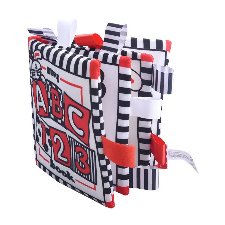 Four cloth books with bird, snail, zebra, and ABC designs featuring haha mirror and rattle functions