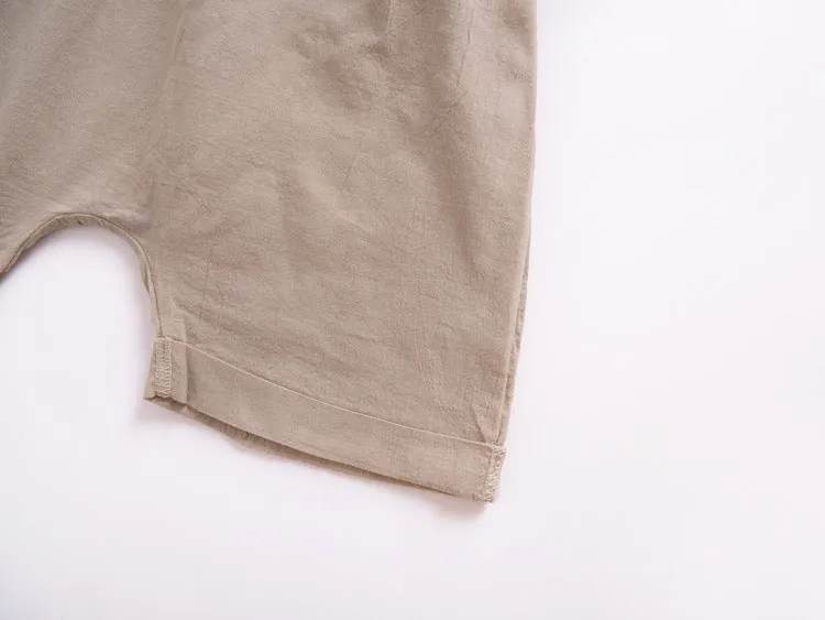 Children's khaki cotton overalls shorts with bow detail and straps, front view