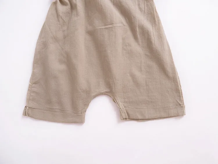 Children's khaki cotton overalls shorts with bow detail and straps, front view