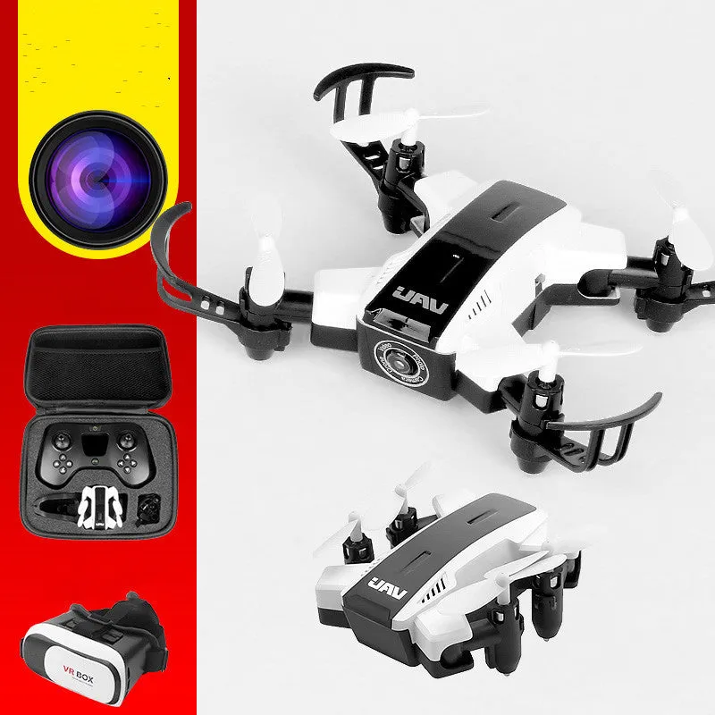 Quadcopter drone with HD 2 million pixel camera, black colour, propellers, and VR glasses on a white background