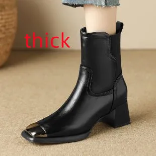 Brown high-heel Martin boots with side zipper and decorative metal rivet details.