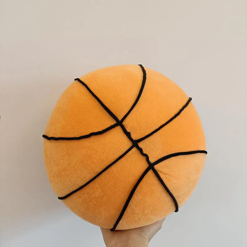 Soft spherical basketball plush toy in orange with black lines, 28cm tall, on a light background