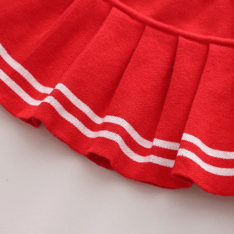 Knitted baby girl two-piece skirt suit in pink with bow detail and long sleeves, autumn wear