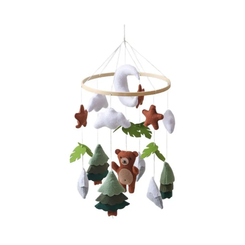 Handmade felt teddy bear bed bell in white on a wooden base for children's soothing sleep