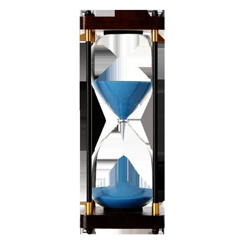 Wooden hourglass timer with solid wood frame and coloured sand on a desk