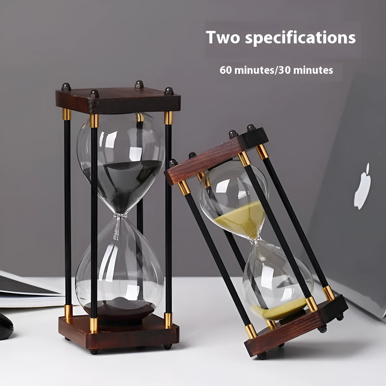 Wooden hourglass timer with solid wood frame and coloured sand on a desk