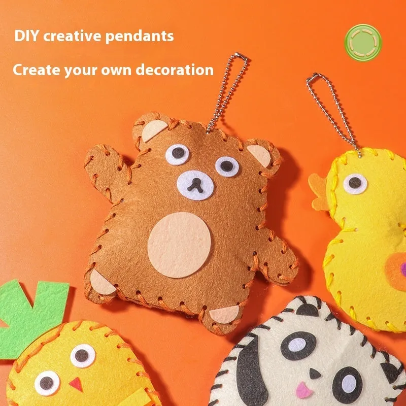 Children's non-woven sewing kit with music theme, cloth pieces, and tools in a colour box measuring 19.5x16x5cm