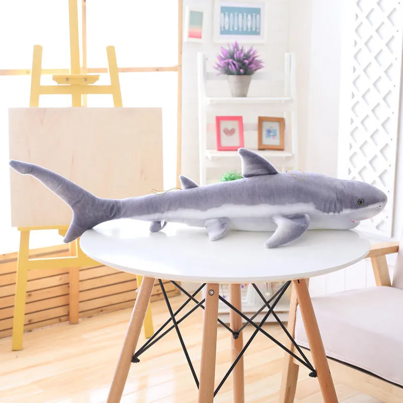 Lifelike soft shark plush toy in shark colour, available in 60cm, 100cm, and 140cm heights, net pocket packaging