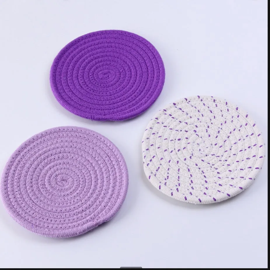 Three round cotton cord coasters in blue colour with modern simplicity design